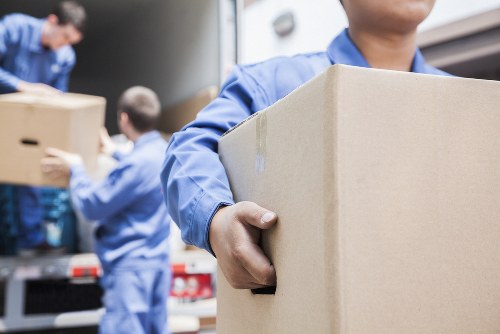 Furniture pick-up service handling a sofa in Slough