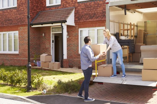 Team preparing a home removal in Slough with boxes and furniture