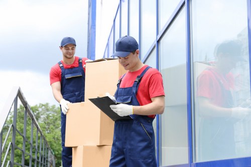 Removal team preparing furniture safely during a house move