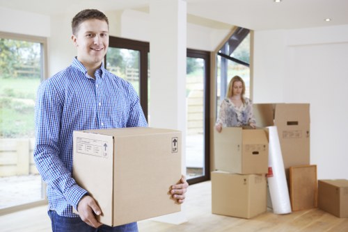 Removal team handling boxes and furniture during a Slough home move