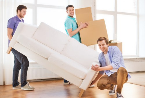 Moving truck and wrapped furniture during removals in Slough