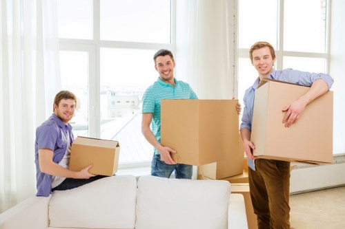 People organizing boxes in a self-storage unit in Slough