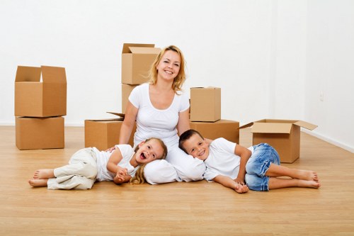 Local moving team transporting furniture in Slough