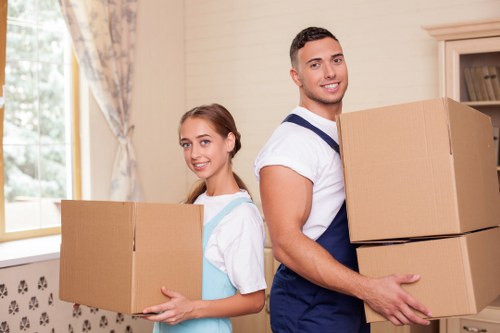 Professional movers packing household items